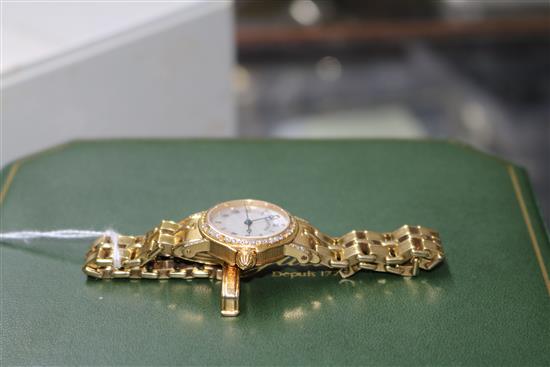 A ladys 18ct gold and diamond set Breguet wrist watch,